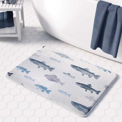 Blue fish bath mat made of microfiber with non-slip features.