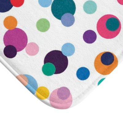 Close-up of multi-colored polka dot print on Ozscape Designs kids bath mat.