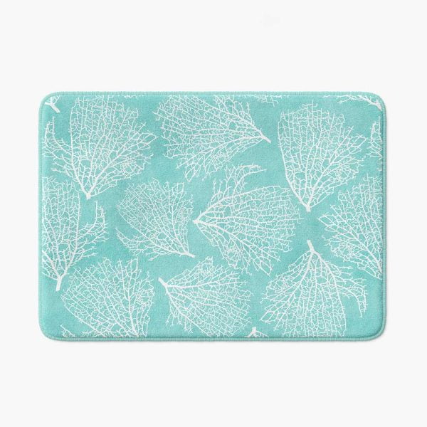 Blue turquoise non slip bath mat made of microfiber with coastal coral pattern.