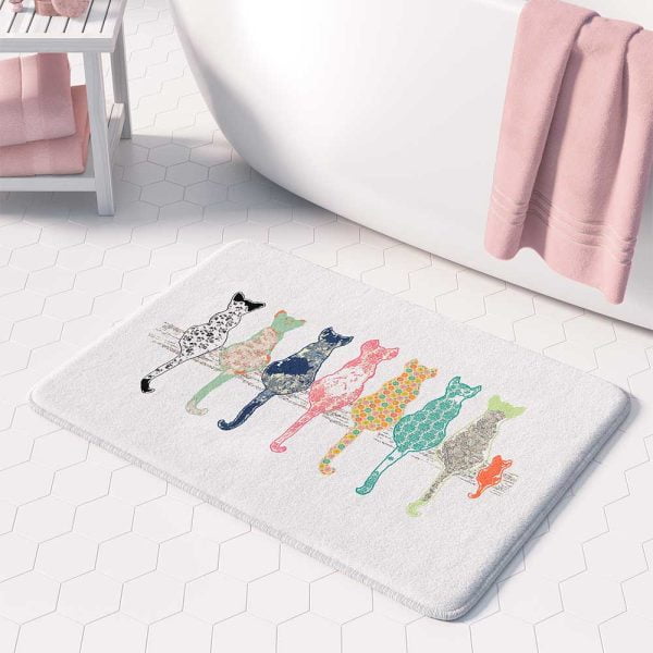 White bath mat adorned with floral cats pattern