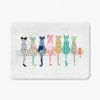 White bath mat adorned with floral cats pattern