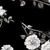 close up black rose floral print on blacka nd white bath towels