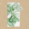 Stylish Beach Towel with Tropical Green Monstera Palm Leaves Design by Ozscape Designs