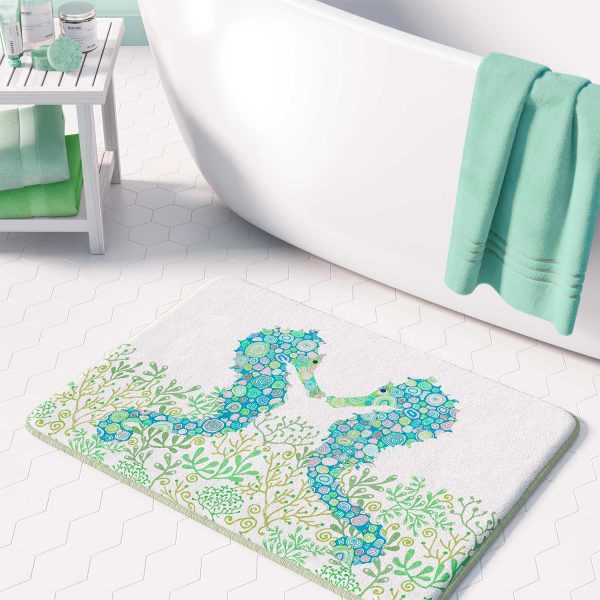 Non-slip microfiber bath mat for kids' bathroom with blue and green seahorse pattern.