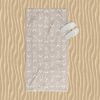 Coastal Fish Patterned Beach Towel in Beige and White.