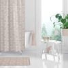 beige and whtie bathroom with coastal fish shwoer curtain