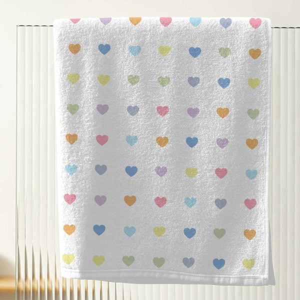 white bath towel with pastel love hearts for little girls bathroom