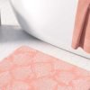 Pink coral patterned microfiber bath mat for coastal bathroom vibe.