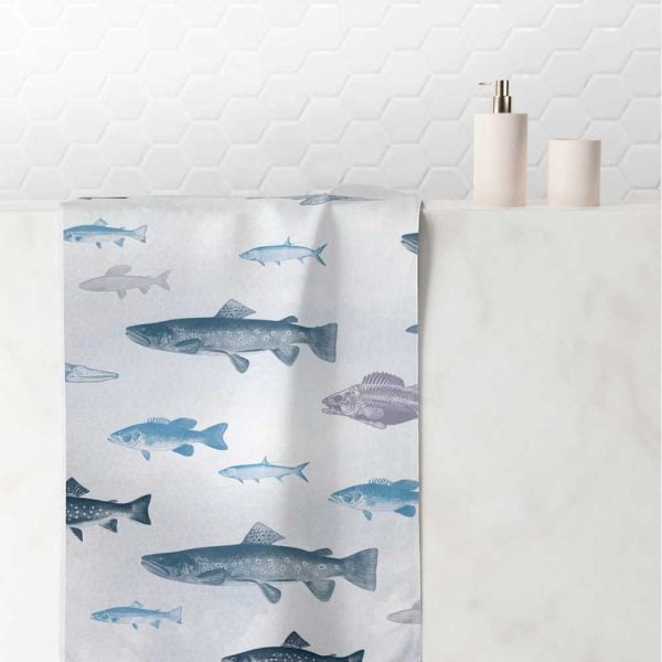 white and blue hand towel with coastal fish pattern