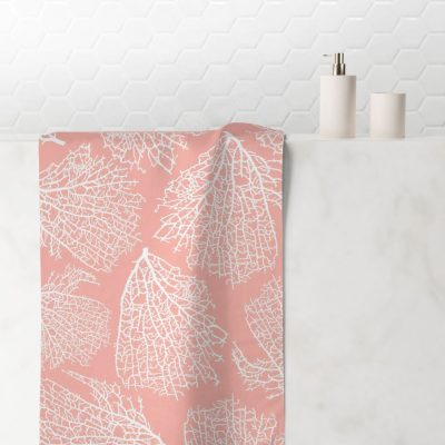 Hand towel with elegant tropical coral pink pattern.