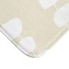 Close-up view of the microfiber texture on the coastal beige and white pebble striped designer non-slip bath mat.
