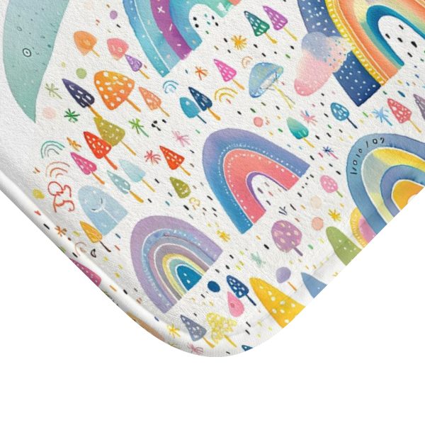 Close-up of rainbow pattern on soft microfiber bath mat for kids' bathroom.