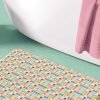 Bathroom scene featuring a basin-sized bath mat (24" x 17") with vibrant multicolor checkered pattern