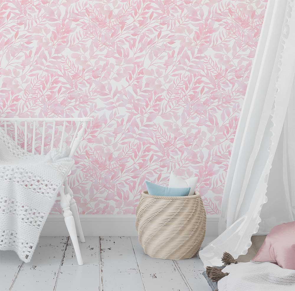 Soft pink watercolor leaves wallpaper in a baby nursery, creating a calming and cozy atmosphere