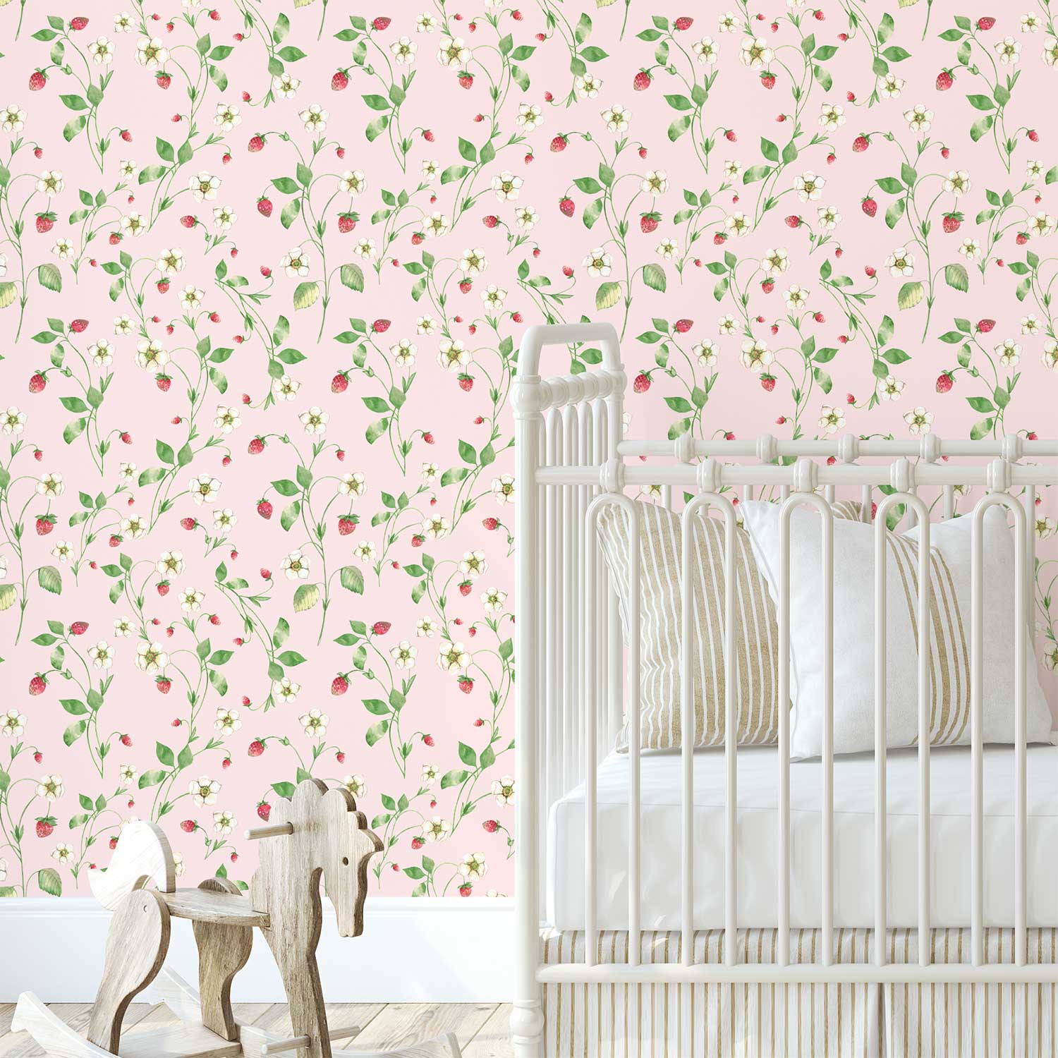 Pink strawberry floral wallpaper in a baby girl's nursery